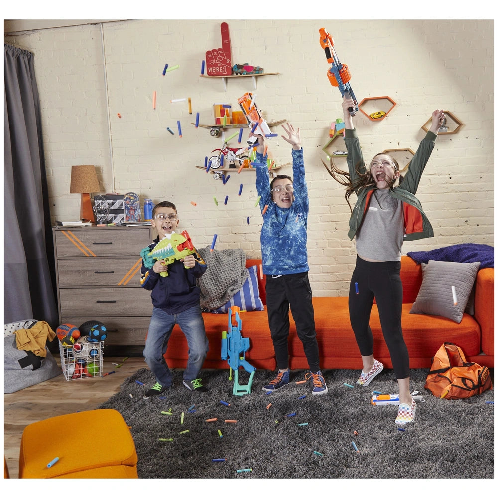 Nerf Elite 2.0 Shockwave RD-15 Blaster held by three children in colorful jackets, playing on a gray carpeted floor.