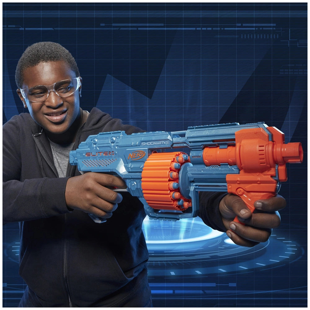 Nerf Elite 2.0 Shockwave RD-15 Blaster held by a person in a black hoodie against a blue digital backdrop.