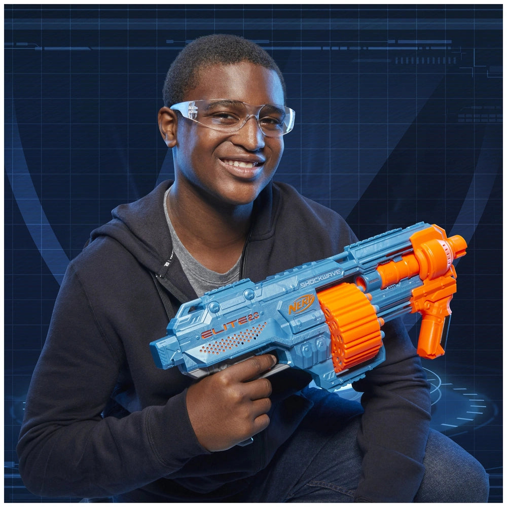 Nerf Elite 2.0 Shockwave RD-15 Blaster held by a smiling person in a black hoodie against a blue and black graphic background