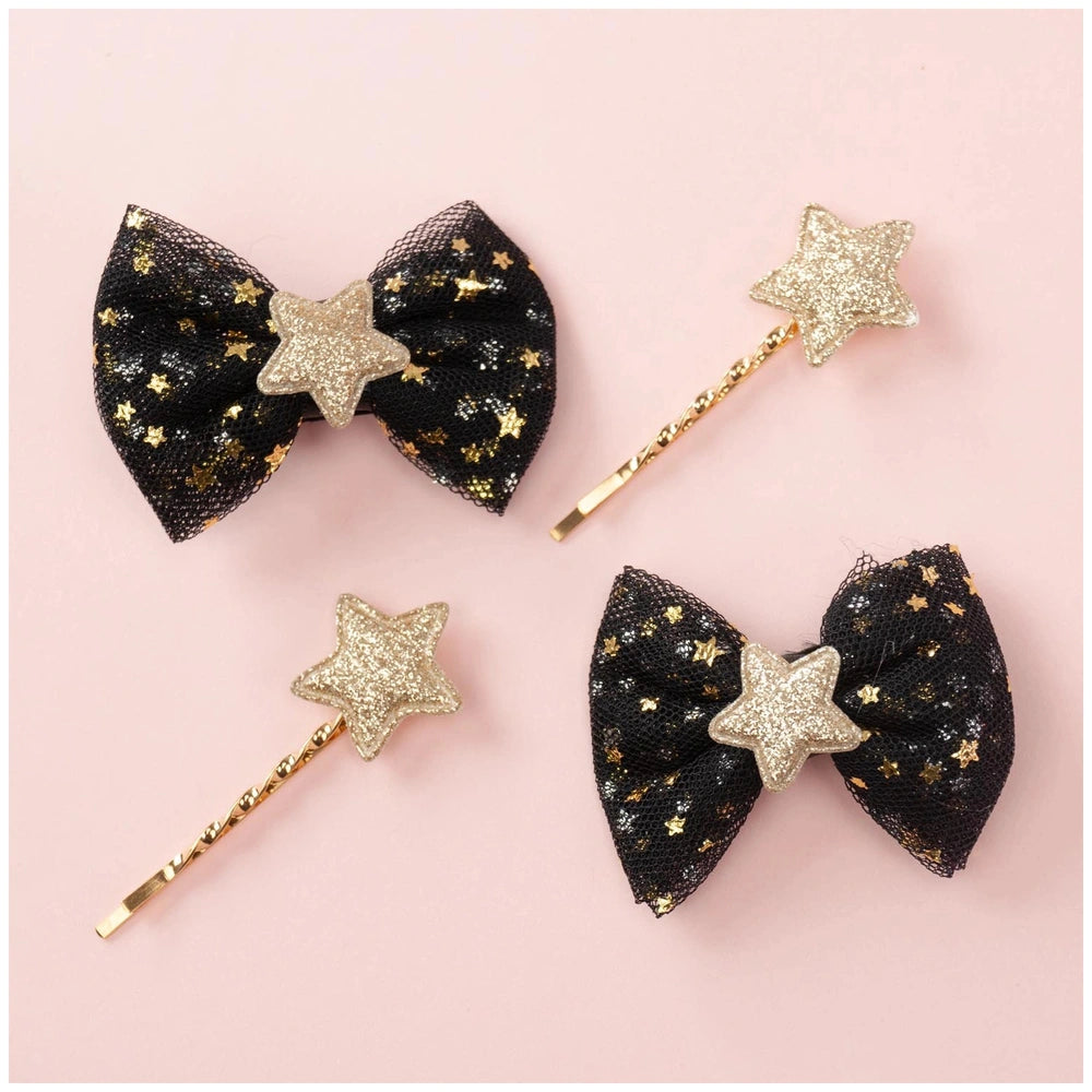 Classy ribbon hair clip set featuring two black bows and two gold bows adorned with glitter stars.