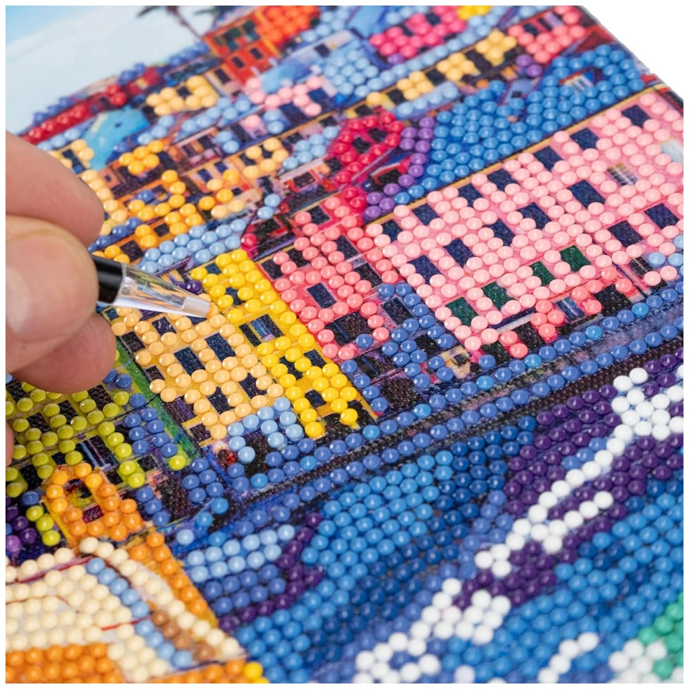 Diamantiny Artist Level Up painting kit featuring colorful plastic beads on cardstock in vibrant hues of blue, yellow, red, p