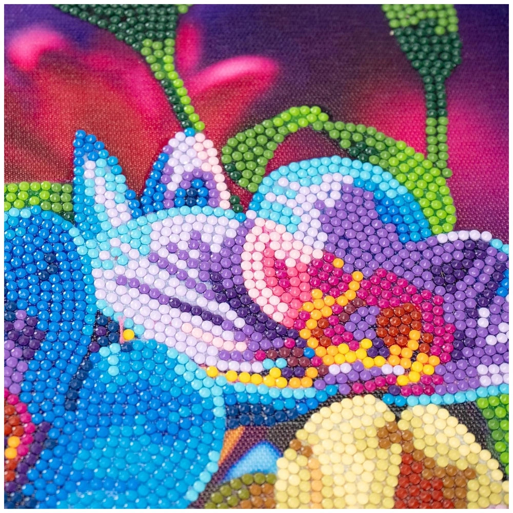 Diamantiny Artist Level Up canvas features a close-up of a textured floral fabric with blue, green, pink, and purple hues.