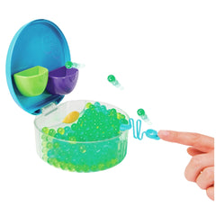 Orbeez Water Beads Surprise Activity Orb Set featuring a translucent bowl filled with bright green spherical beads and a blue