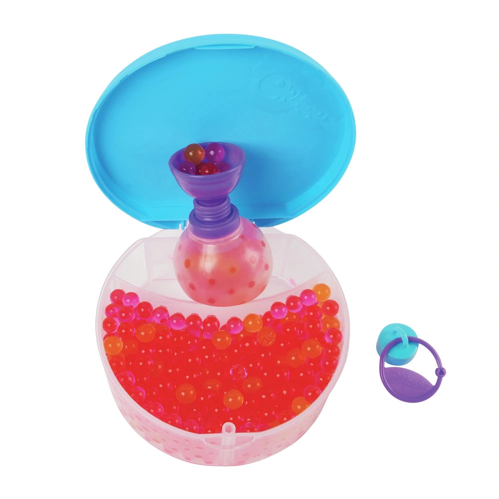Orbeez Water Beads Surprise Activity Orb Set featuring a translucent container with a blue lid and shiny red balls inside.