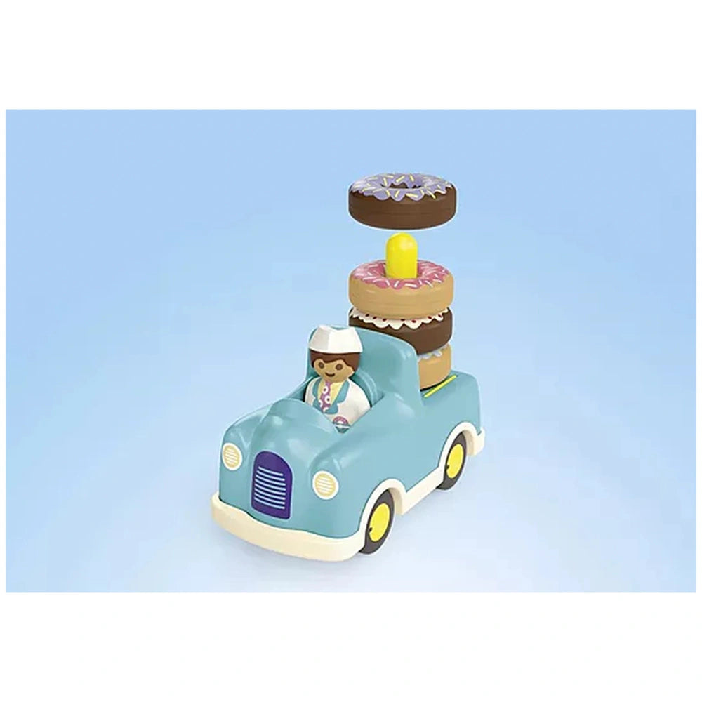 Playmobil Crazy-Donut-Truck features a glossy blue plastic body with white accents and yellow wheels, showcasing vibrant toy 