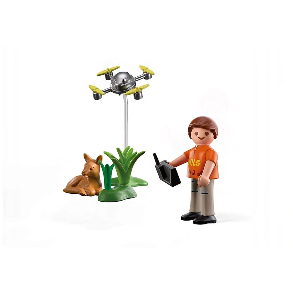 Playmobil Fawn Rescue with Drone toy set features a brown fawn on a green plant base holding a black object.