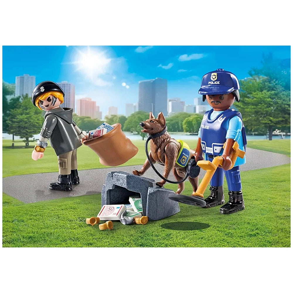 Playmobil police officer in blue uniform with a brown and black dog on vibrant green grass, showcasing detailed accessories.