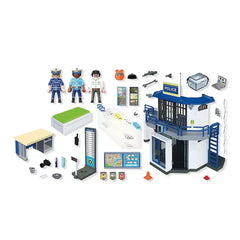 Playmobil Police Station toy set features a blue building, desk, chair, toy car, and figures made of plastic, wood, and fabri
