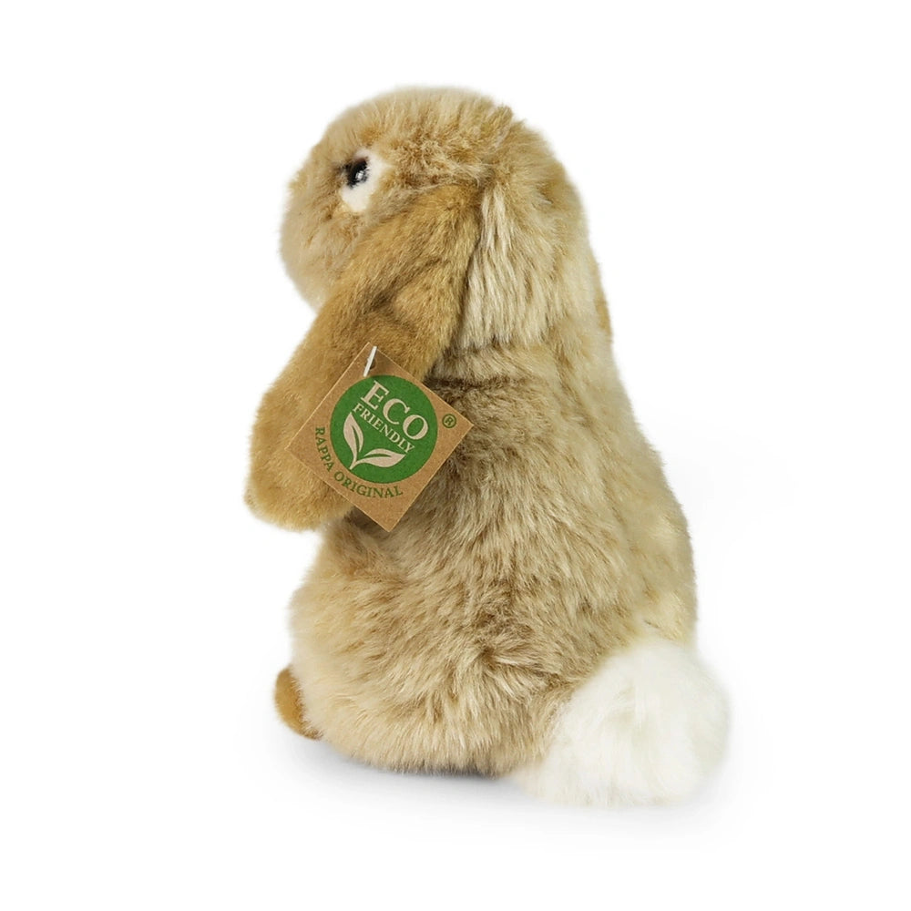Plush beige hare with fuzzy fur and eco-friendly tag featuring a green background and white leaf symbol, sitting upright.