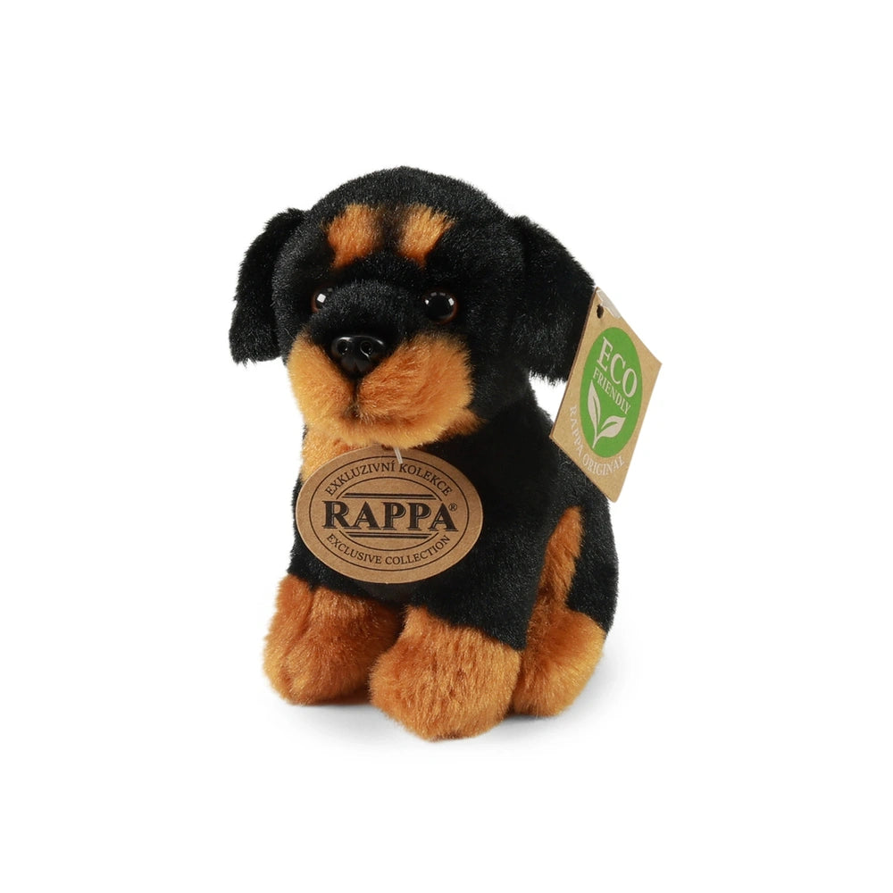 Plush dog toy with black and brown fur, upright with a collar tag featuring "RAPPA" and an eco-friendly symbol.