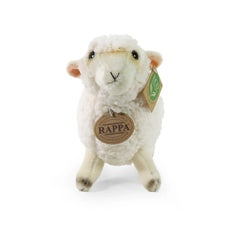 Plush sheep stuffed animal, soft white fabric, standing upright with a brown tag featuring a green logo on its ear.