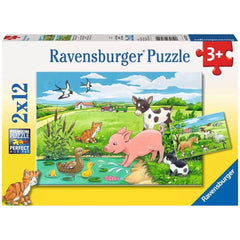 Ravensburger puzzle box featuring a farm animal theme with a visible puzzle inside, set against a yellow background.