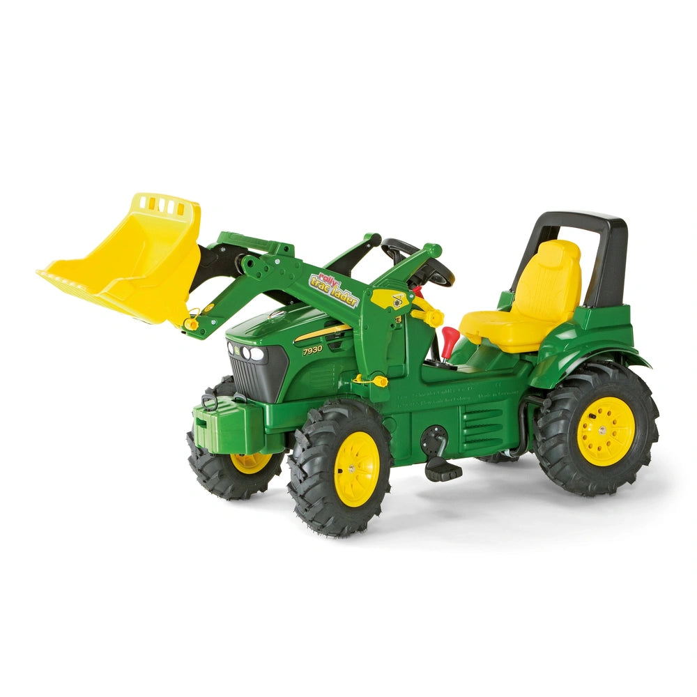 Rollyfarmtrac John Deere 7930 toy tractor features a green body, yellow scoop, and wheels, perfect for imaginative play.