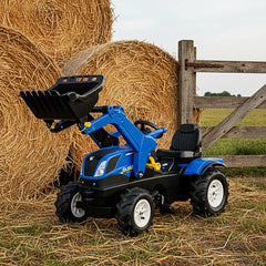 Rollyfarmtrac New Holland riding toy features blue and black inflatable wheels, black seat, and yellow handle against a brown