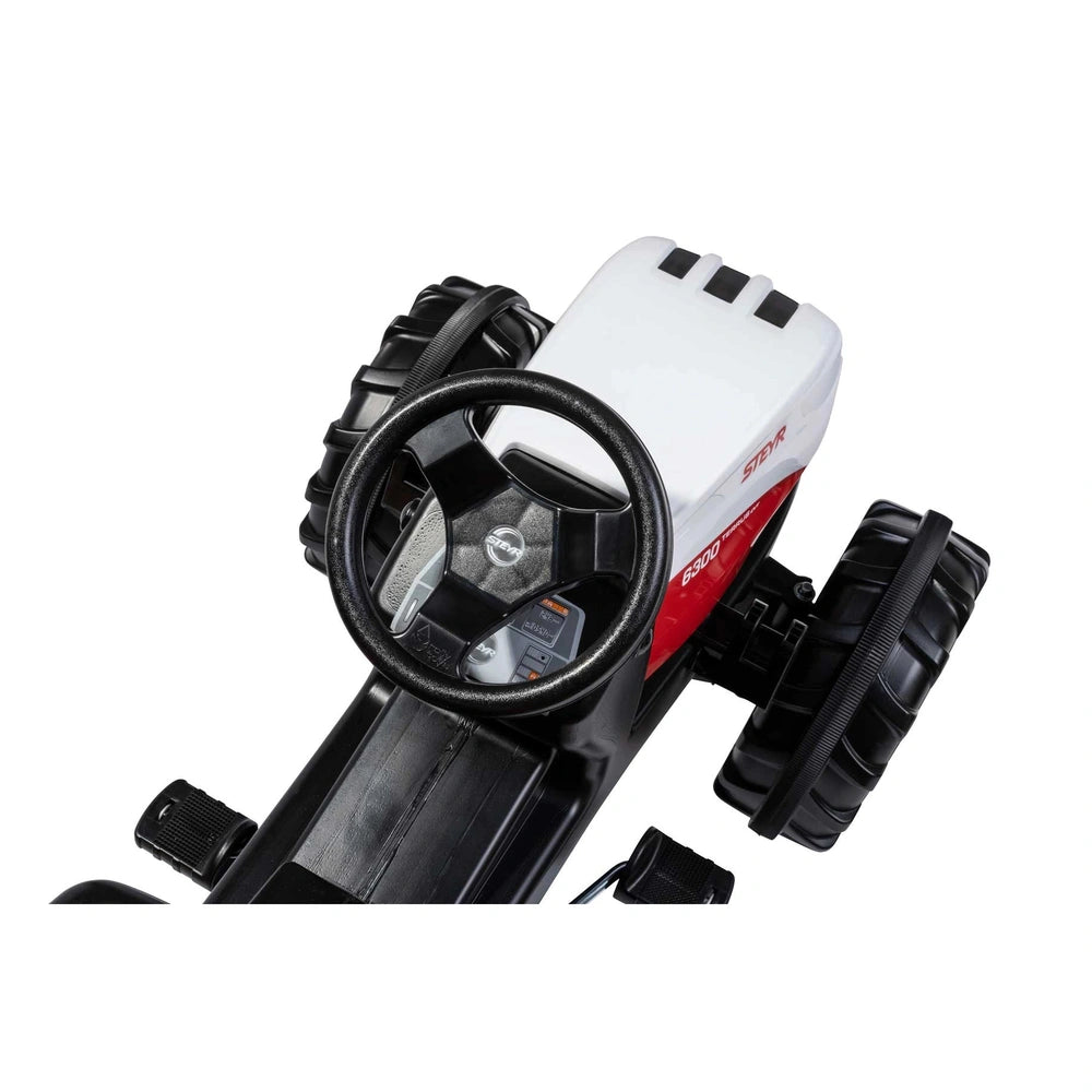 Rollyfarmtrac Premium II Steyr 6300 Terrus CVT riding toy features a glossy black body with red and white accents against a w