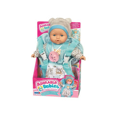 RS Toys Adorable Babies Doll in a blue outfit with a pink bow, displayed in a colorful cardboard box with playful branding.