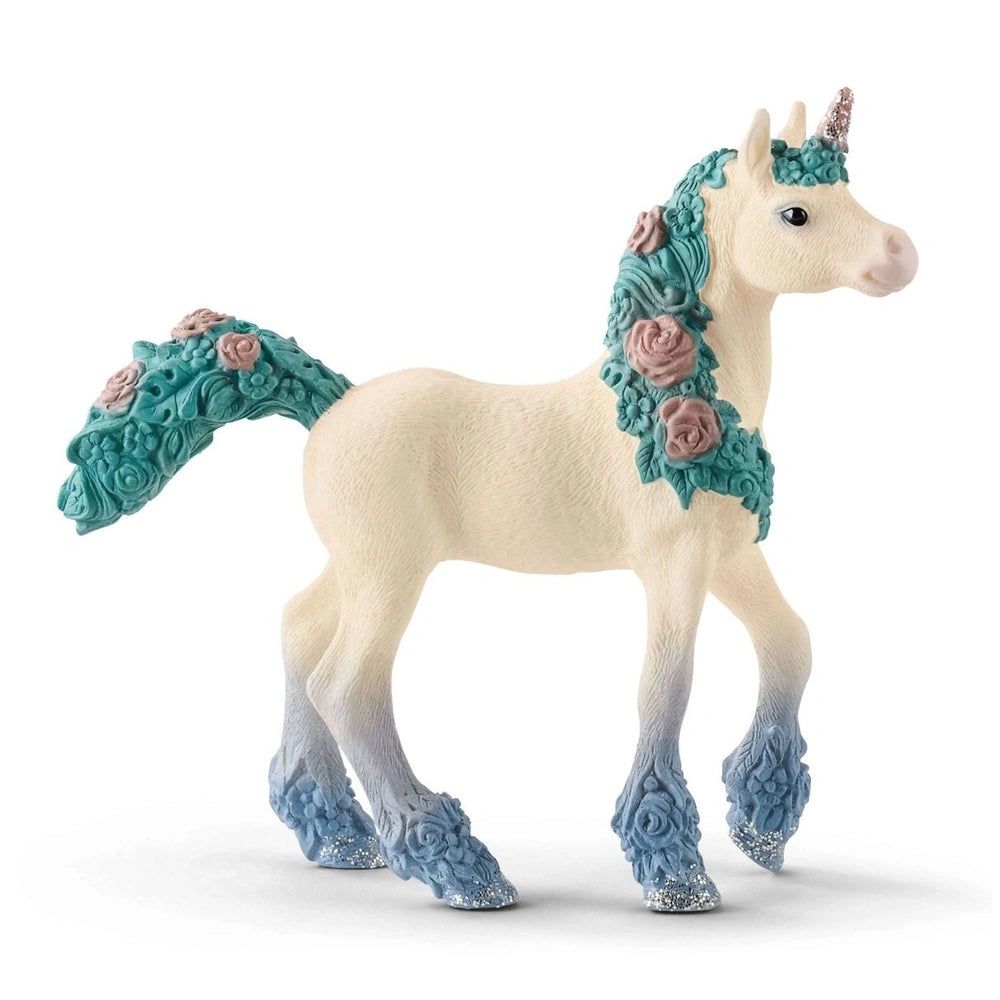 Blossom Unicorn Foal toy figure with white body, turquoise mane, glittery blue hooves, and rose-patterned detailing.