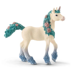 Blossom Unicorn Foal toy figure with white body, turquoise mane, glittery blue hooves, and rose-patterned detailing.