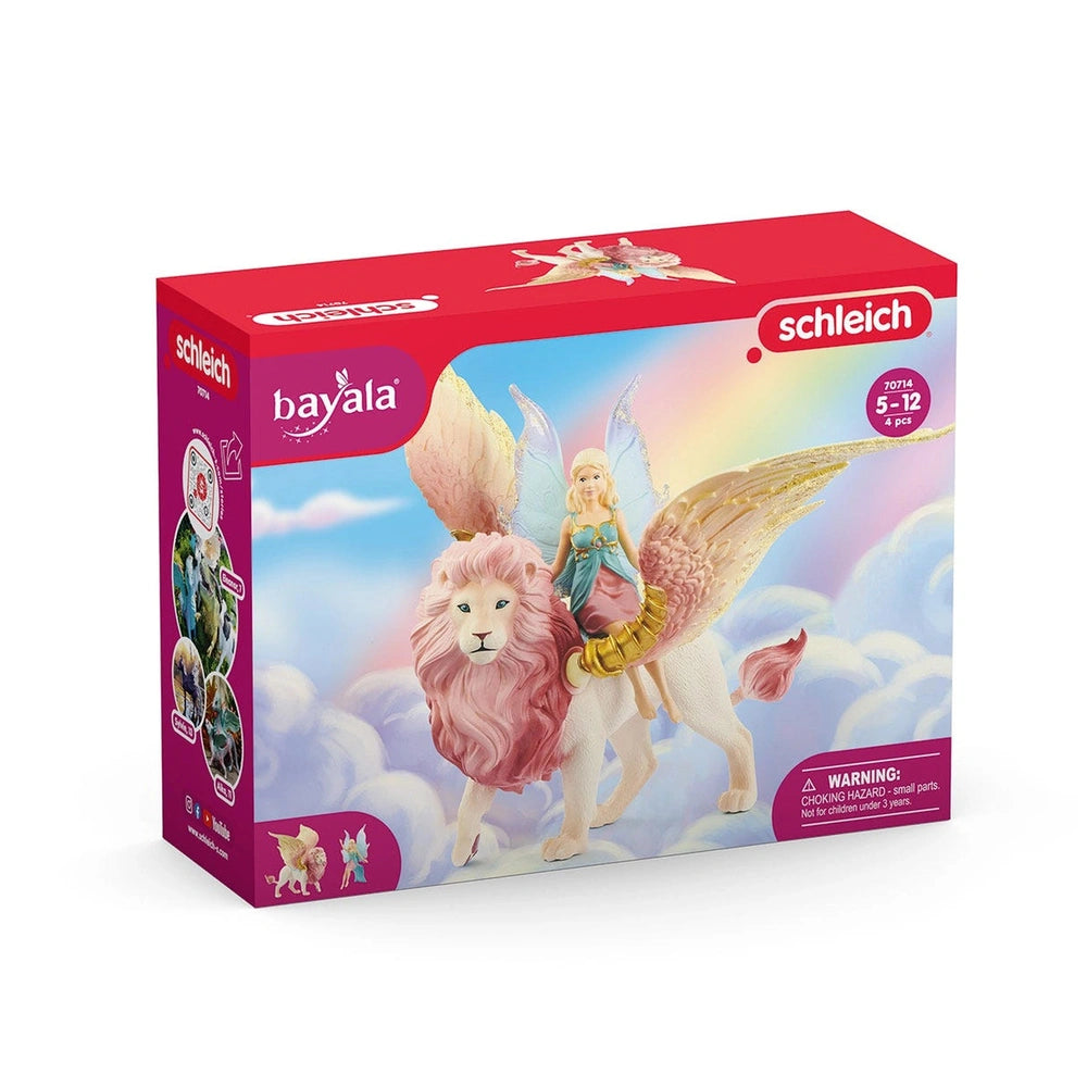 Schleich Bayala fairy in flight on a pink and white winged lion, displayed in glossy red packaging with a clear window.