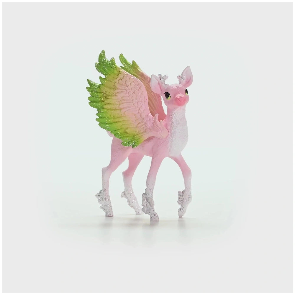 Magical Fawn toy figure with pink body, green accents, wings, tail, mane, antlers, eyes, nose, mouth, and hooves.