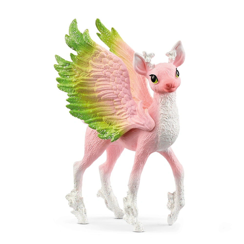 Schleich Magical Fawn toy figure in pink and green, featuring wings, ears, eyes, and a detailed body with hooves and mane.