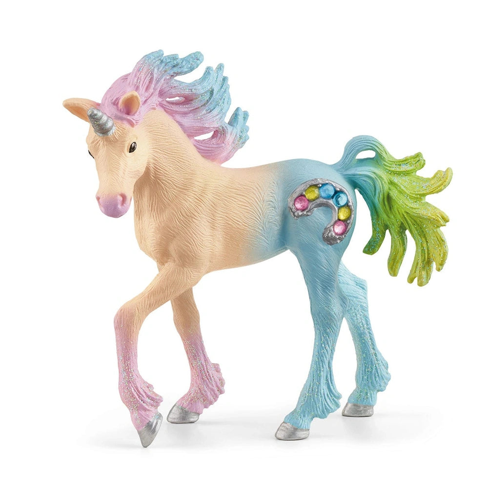 Schleich Marshmallow Unicorn Foal features a pale pink body, glossy mane, and vibrant green tail with glittery accents.