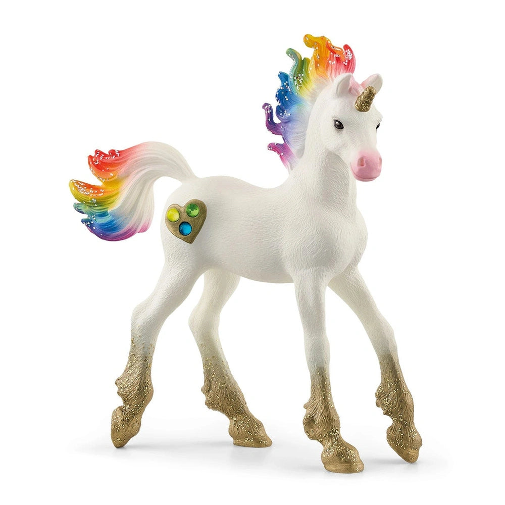 Schleich Rainbow Love Unicorn Foal features a glossy white body, multicolored mane, gold hooves, and a heart charm.