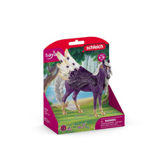 Schleich Bayala Star Pegasus Mare toy figure in purple with white and gold accents, packaged in pink matte cardboard with a p