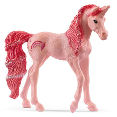 Pink unicorn figure with a mane, tail, horn, and colorful designs featuring stars, hearts, rainbows, and crescent moons.