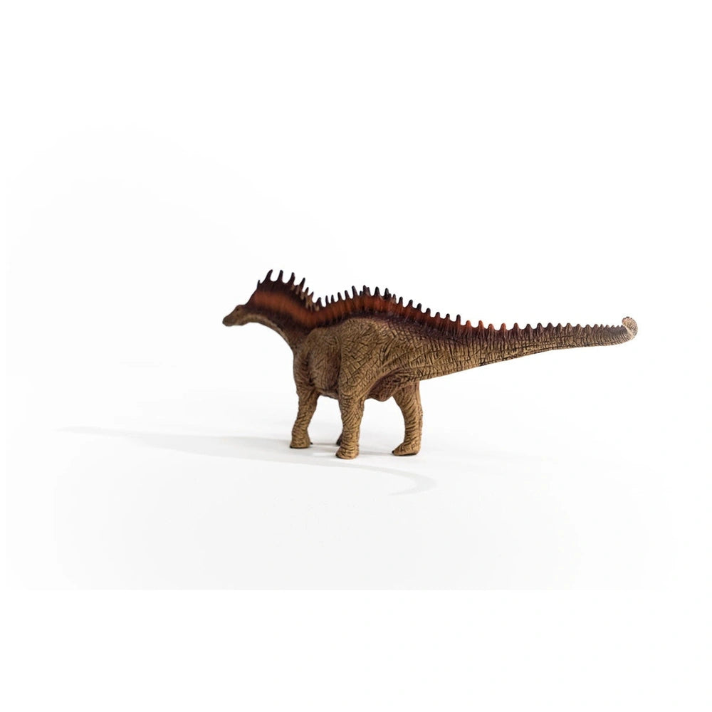 Amargasaurus toy figurine in brown with spines, standing upright on a flat surface against a light background.