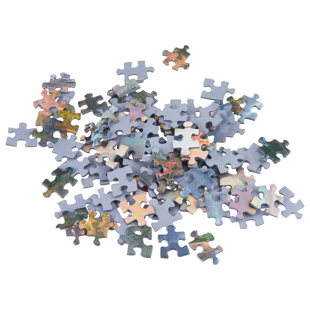 Schmidt Spiele Bambi puzzle pieces in various colors scattered on a white background, showcasing unique interlocking shapes.