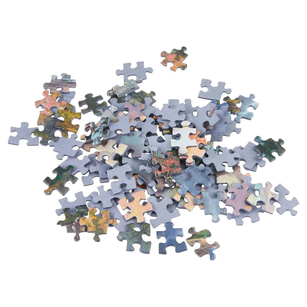 Schmidt Spiele Bambi puzzle pieces in various colors are scattered across a white background, showcasing unique interlocking 