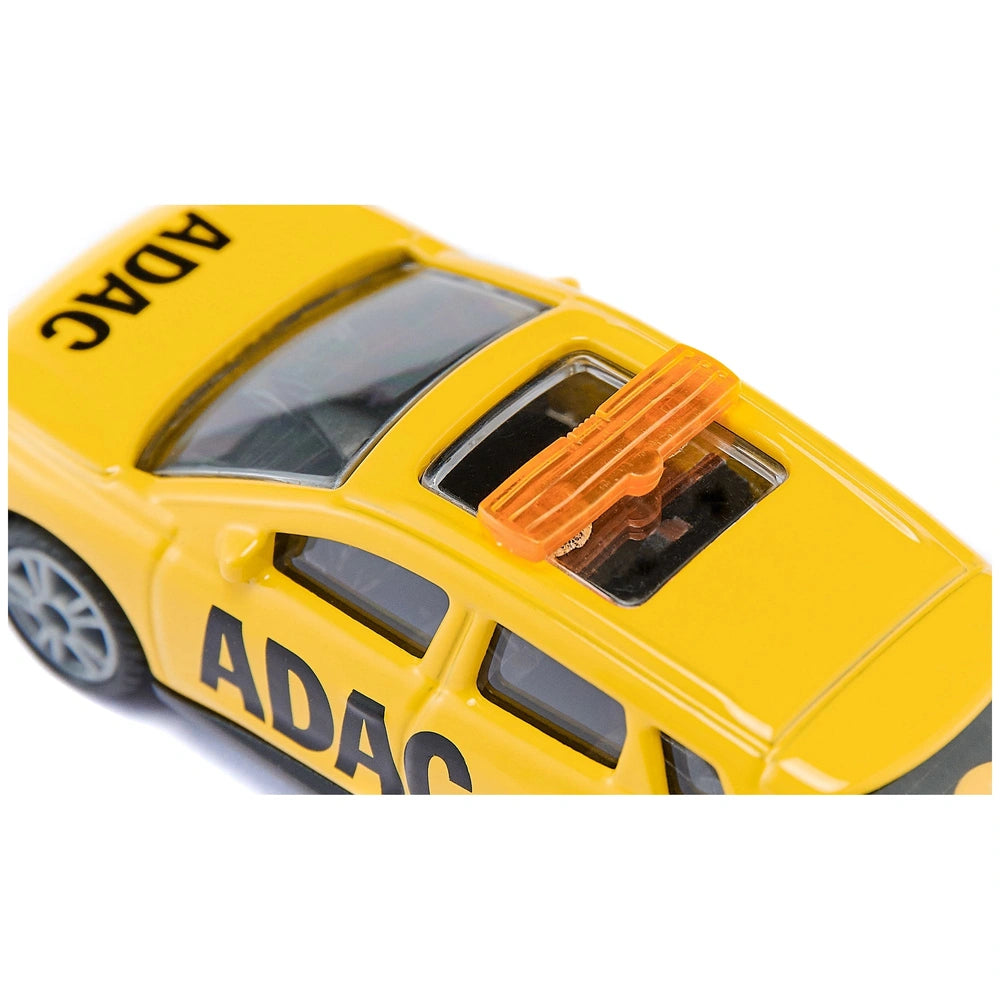 Yellow toy Audi Q4 e-tron breakdown service vehicle with glossy finish, featuring black "ADAC" text and symbols.