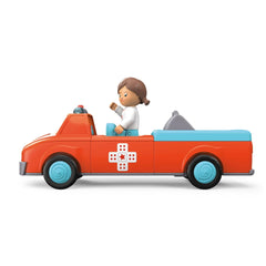Toy truck in orange and blue with a female character in the driver's seat, featuring shiny plastic surfaces.