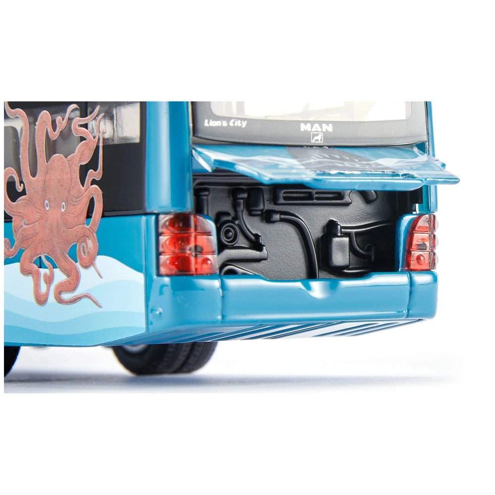 Articulated bus featuring a bright blue bumper, black metal component, and partially visible license plate.