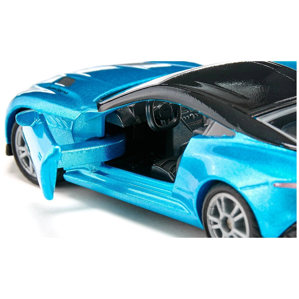 Aston Martin DBS Superleggera toy car in blue with an open door revealing a black interior and shiny exterior.