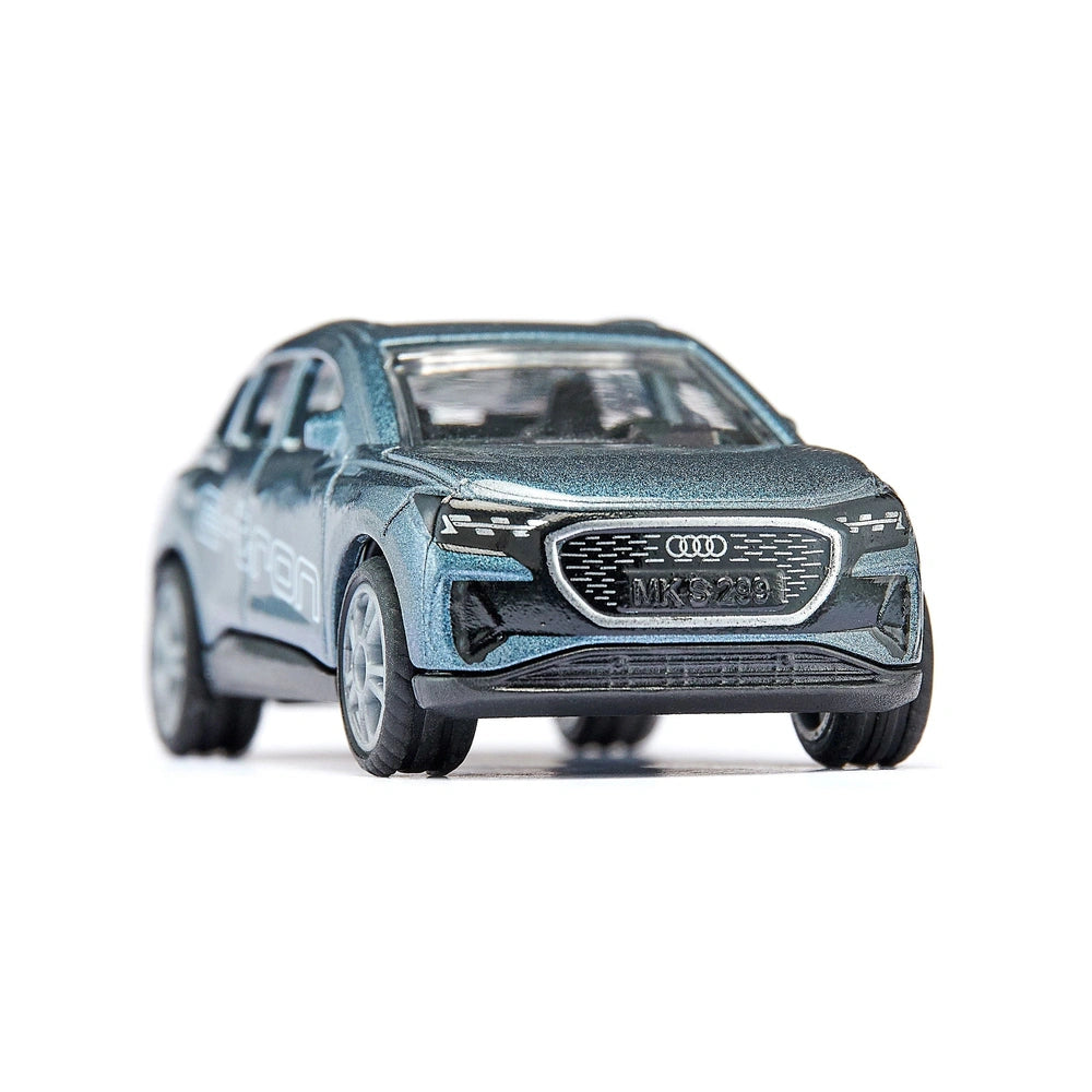 Audi Q4 e-tron model car with a glossy finish, showcasing sleek design and visible branding against a plain white background.