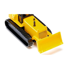 Yellow toy snowplow with a flat blade and black details, positioned on a white background.