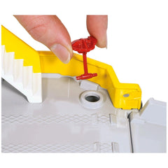 Siku car ferry toy playset features a red plastic component held in a hand alongside a yellow piece with a hole.