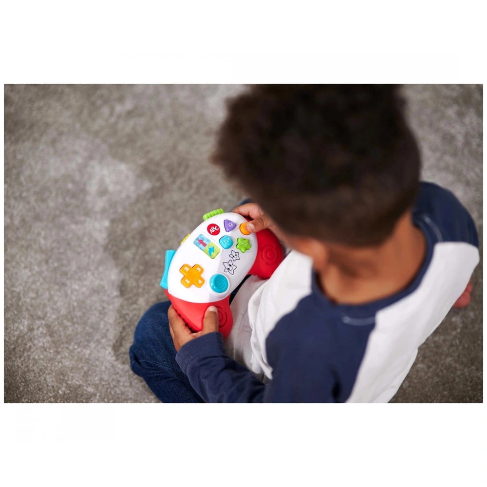 Simba ABC Game Controller: A child with a colorful toy in an indoor setting, learning and engaged with the educational toy.