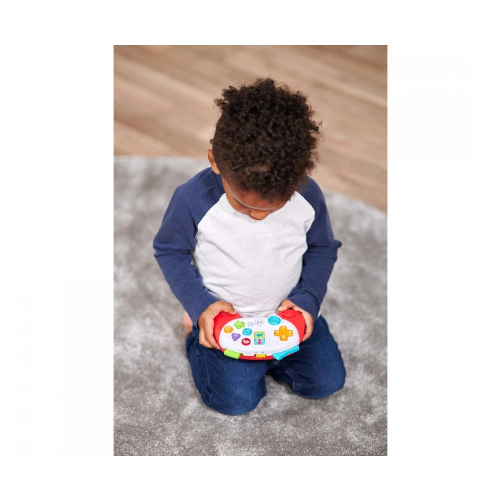Simba - ABC Game Controller in use by a young child on a textured carpet, focusing on the colorful handheld gaming device.