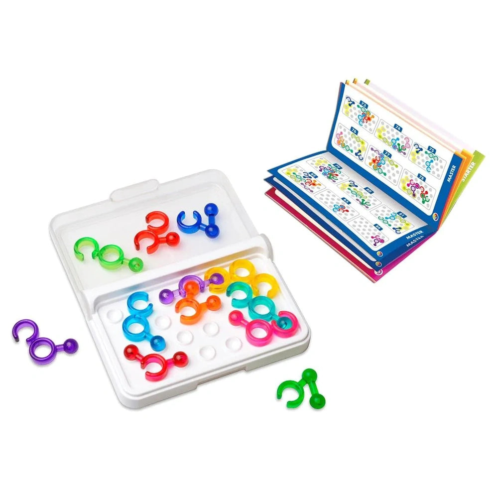 Smart Games IQ Link features colorful plastic rings and connectors scattered on a white surface, alongside a clear container.