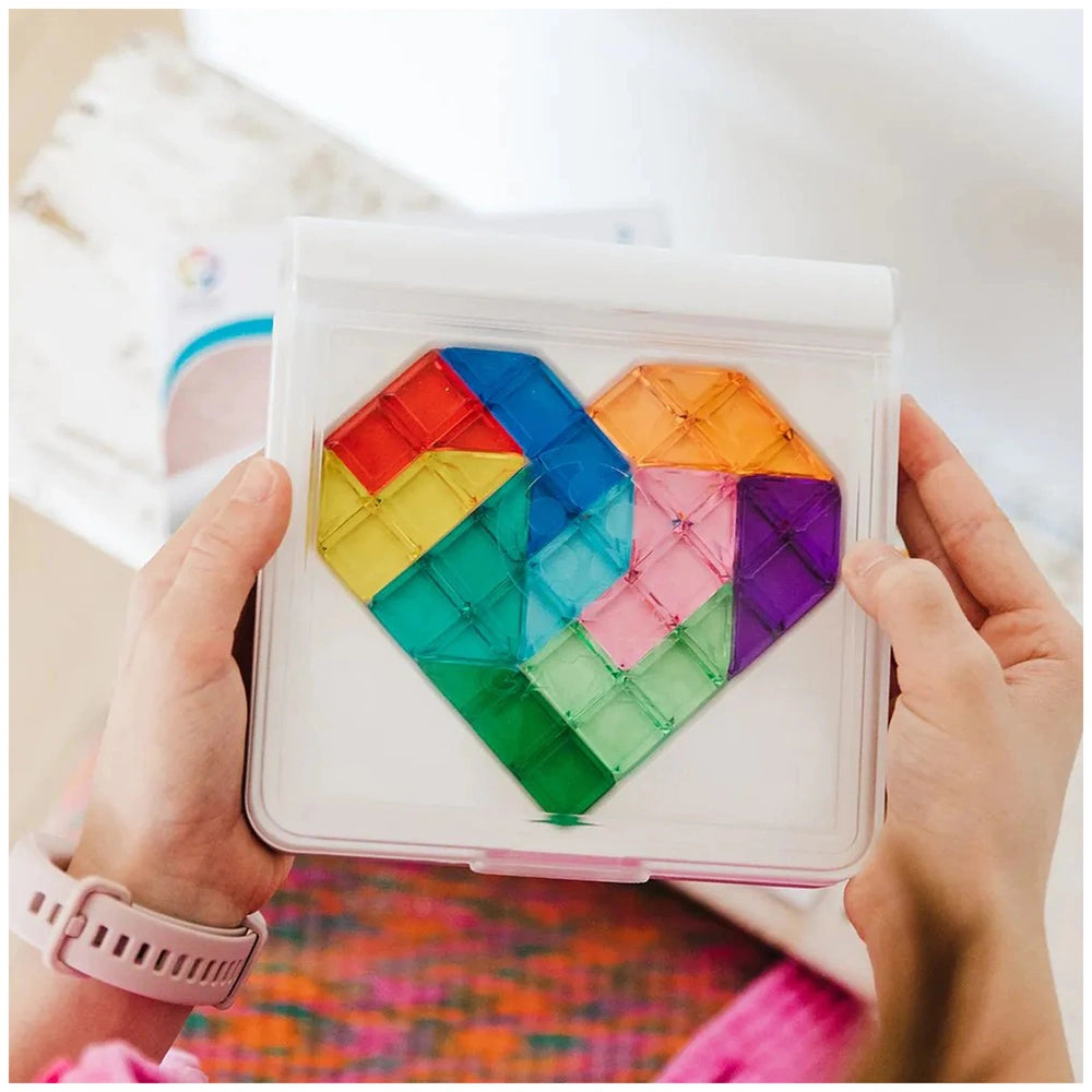 Smart Games IQ Love logic puzzle in a clear container, showcasing a colorful heart-shaped design with a grid pattern.