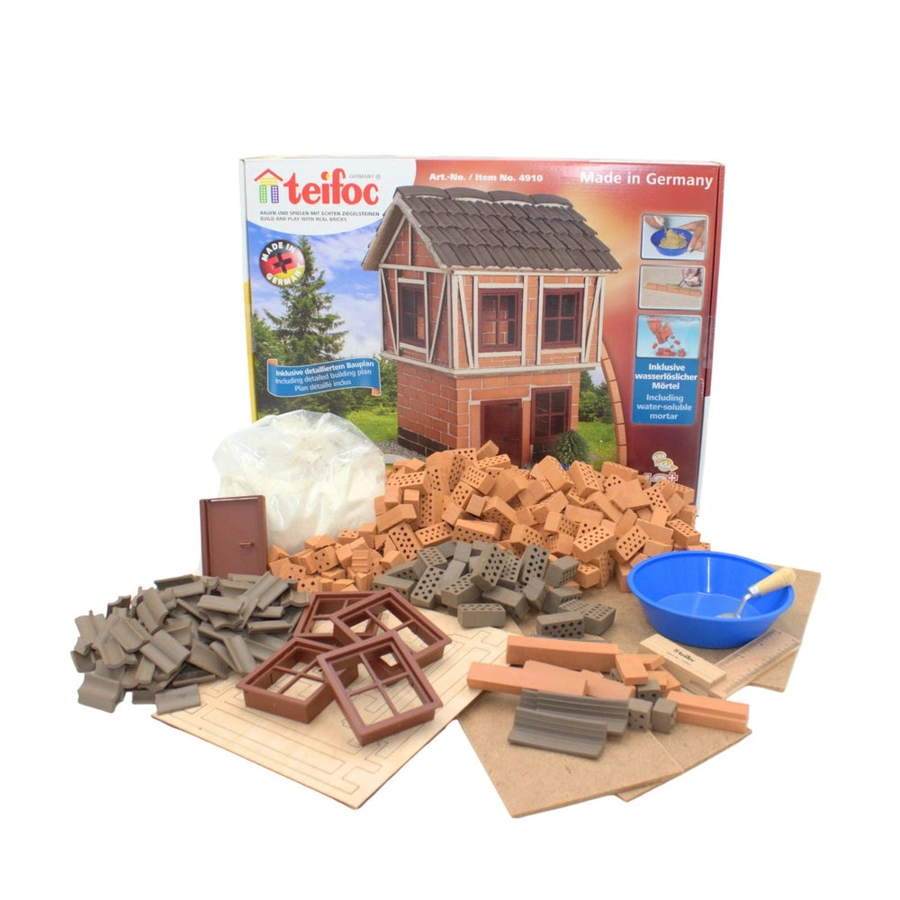 Teifoc big timber-framed house building kit with 380 colorful plastic bricks and components displayed in an open box.