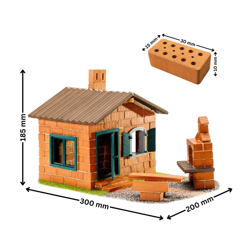 Teifoc model house features a brick exterior, green roof, chimney, and a small garden with a bench and tree.