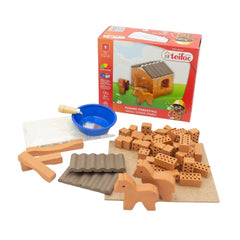 Teifoc Little Horse Stable set features wooden construction pieces, a small house, and a blue bowl on a light surface.