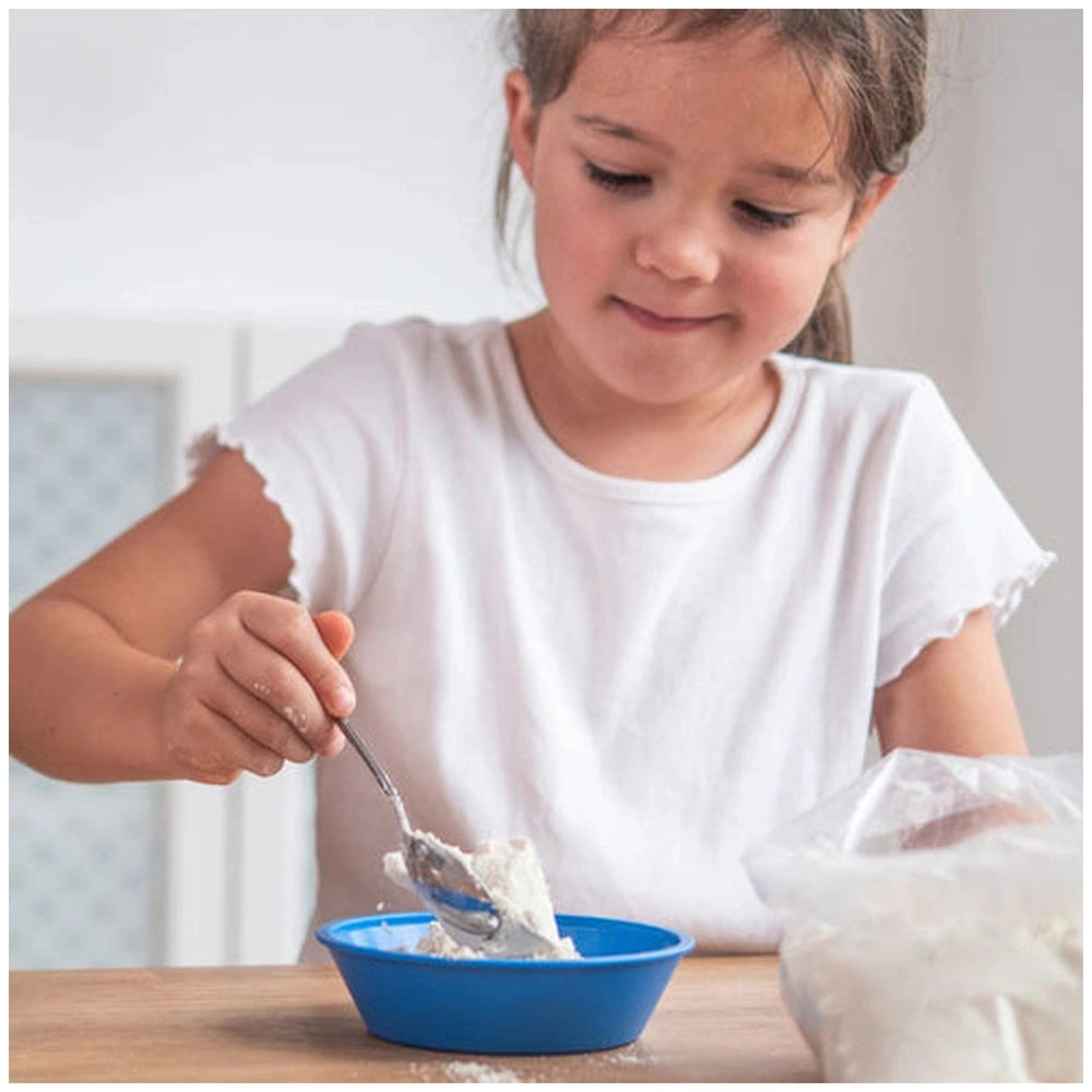 Teifoc water-soluble mortar is showcased alongside a young girl enjoying food from a blue bowl at a wooden table.