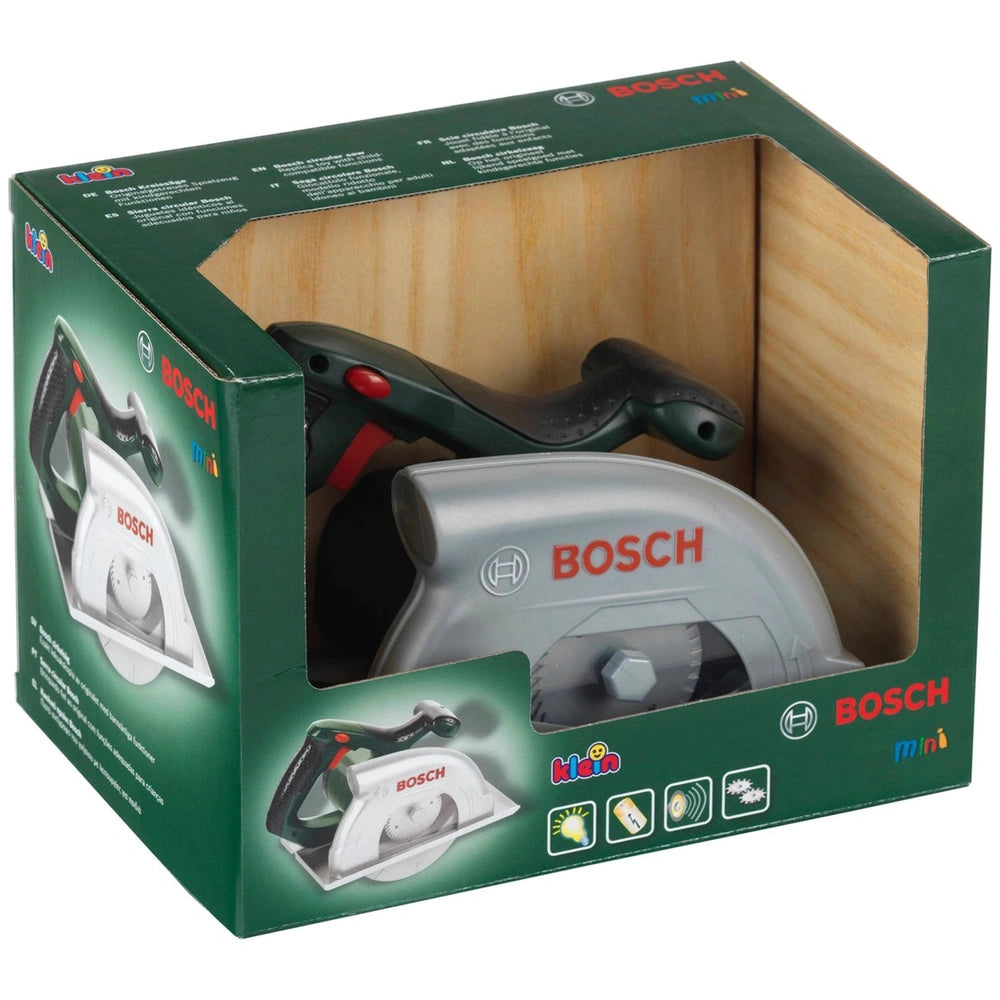 Bosch circular saw toy in gray with black handle, packaged in a green cardboard box with wood interior.