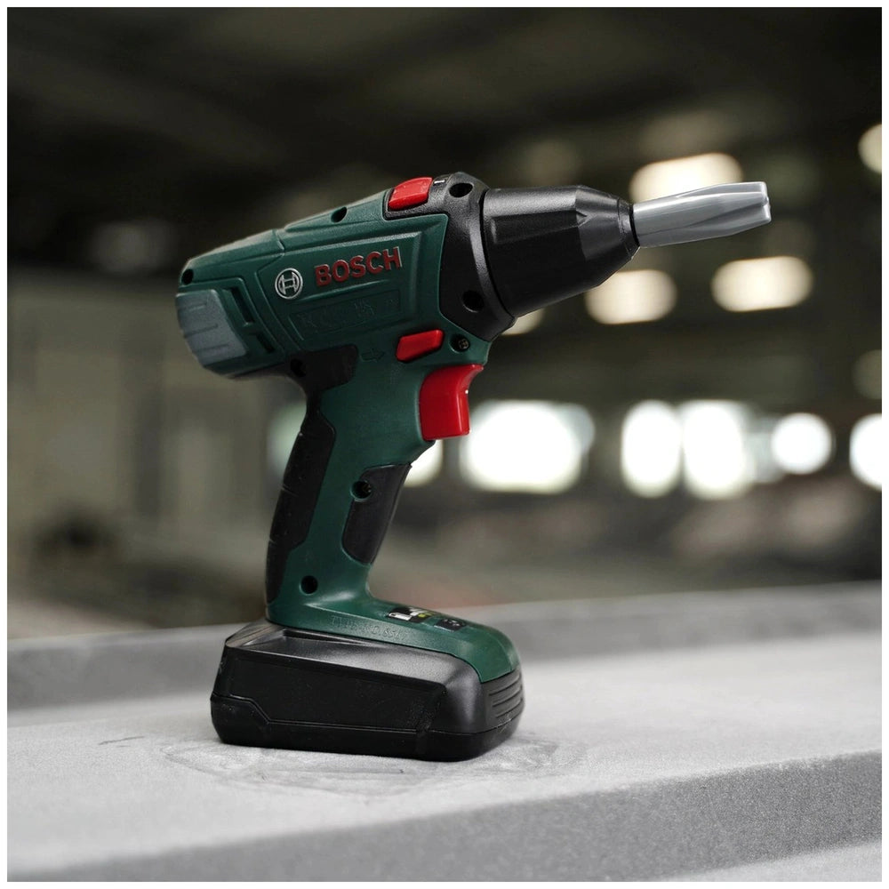 Bosch cordless drill in green and black with a silver trigger and red button, featuring an attached black battery pack.