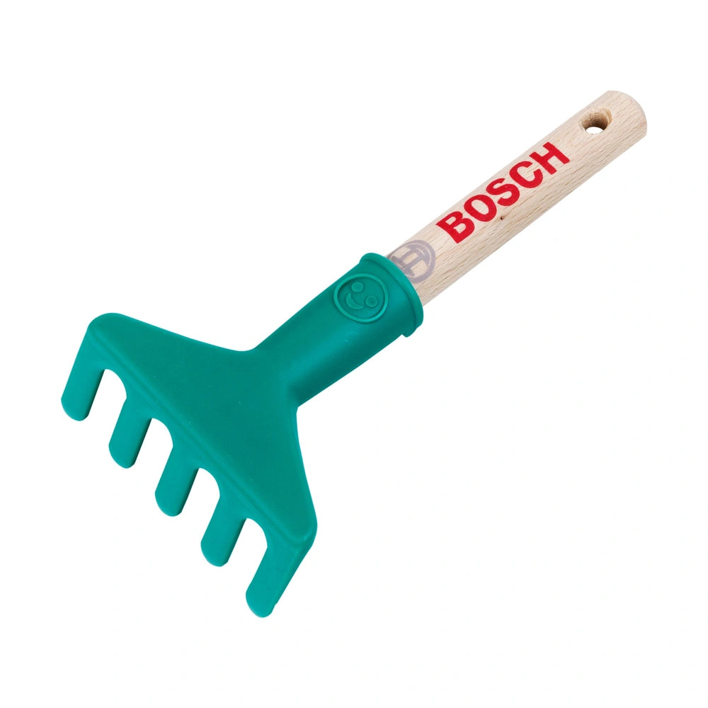 Theo Klein Bosch Garten hand rake features a green plastic head with teeth and a brown wooden handle, marked with a red "BOSC